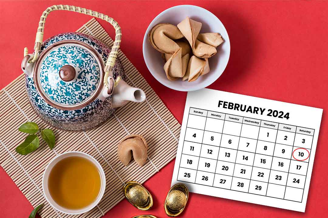 Chinese New Year red background with tea, calendar and cookie