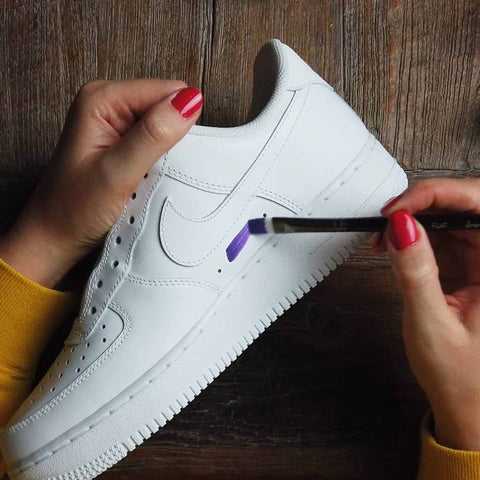 hand painting custom nike air force 1 shoes with a purple leather paint suing acrylic paints. 