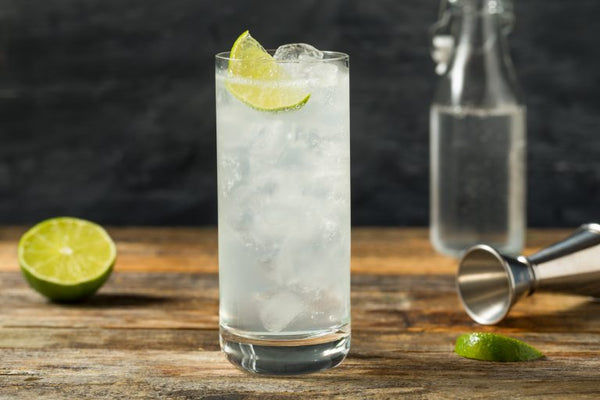 ranch water cocktail on bar with black background