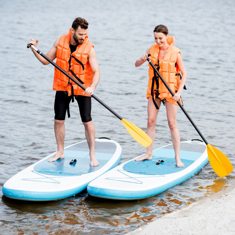 Two people paddle boarding.