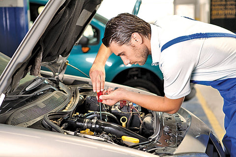 Mechanic fixing car