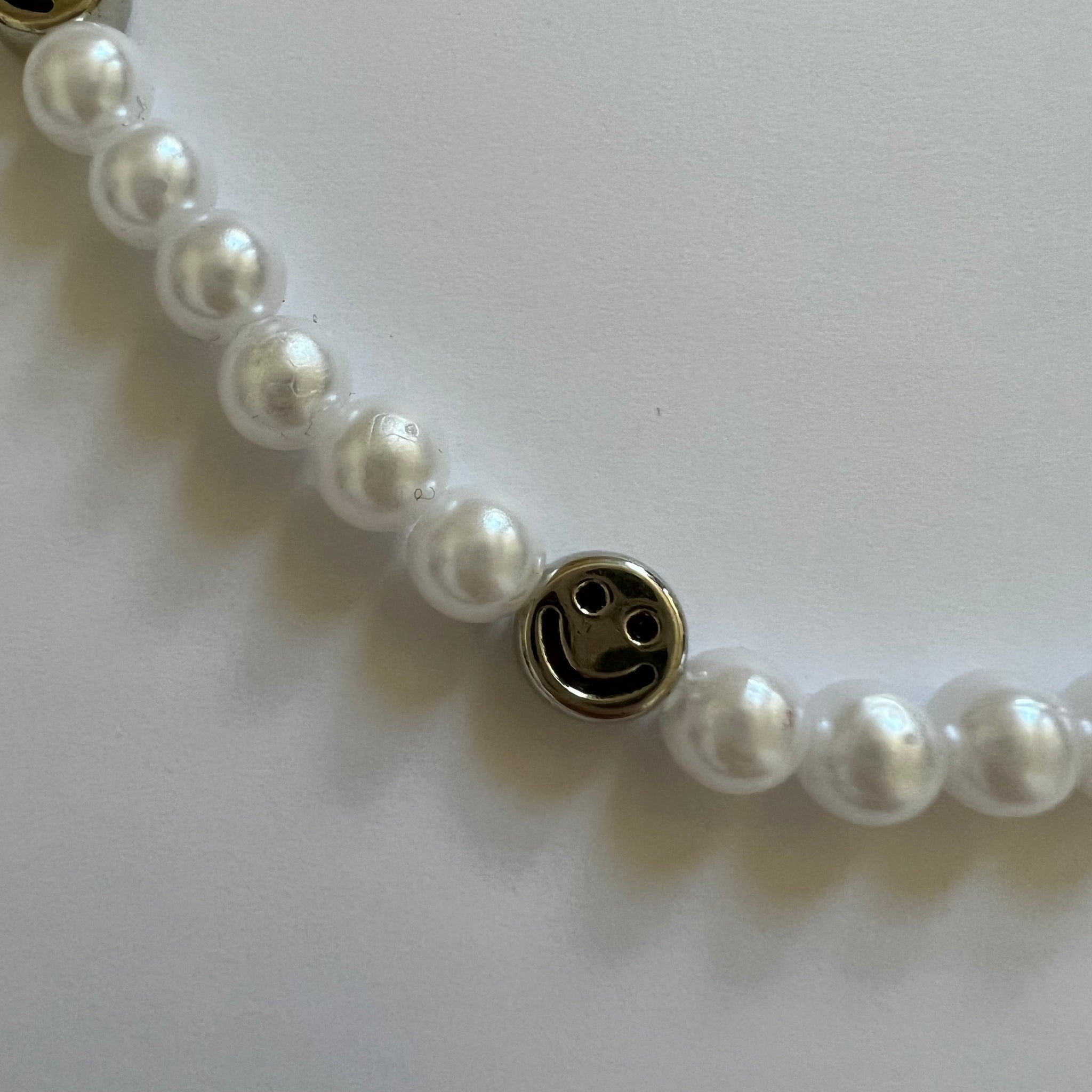 pearl necklace with smiley face