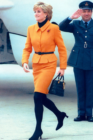 Lady Diana arriving at Liverpool carrying a Lady Dior