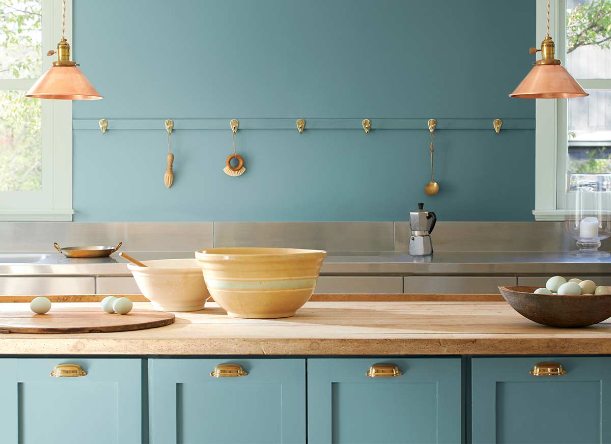 kitchen counter with mixing bowls and eggs - doors and wall are painted Aegean Teal