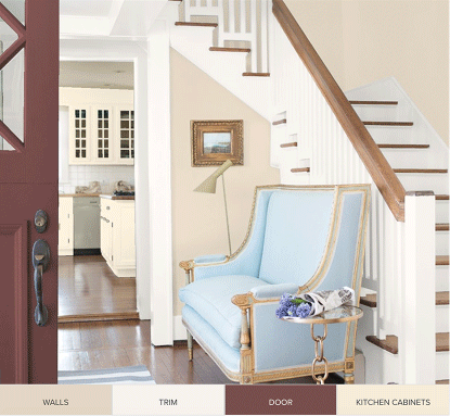front entrance of a home with a loveseat and wooden staircase