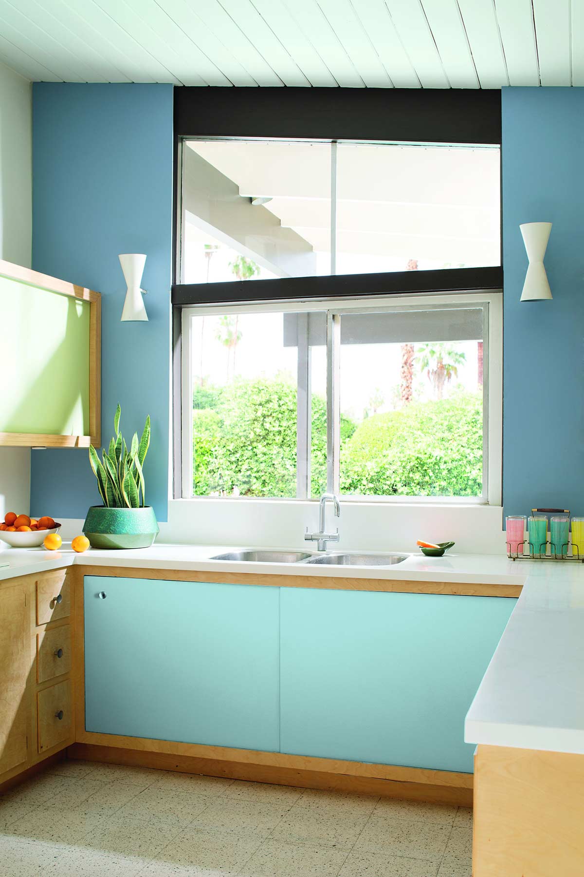 kitchen with light blue cupboards and walls