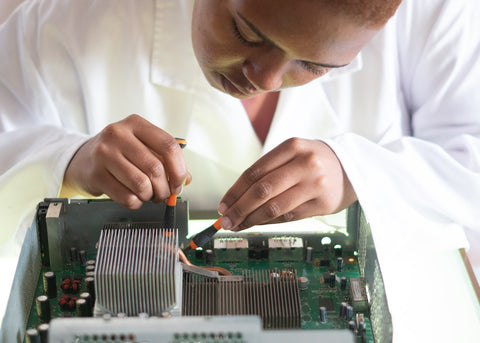 technician at work fixing a piece of tech