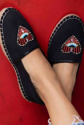 This is an image of Sweetheart Espadrilles, which has a heart embroidered on black canvas ladies shoes