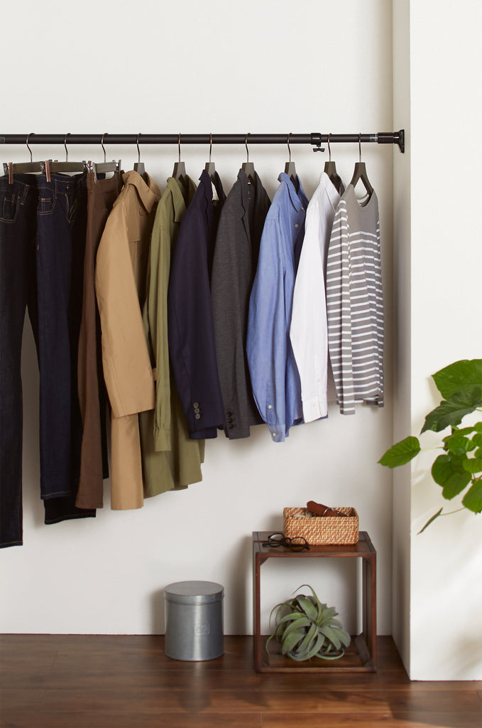 Tension rods create room to store heavy items and hang clothes