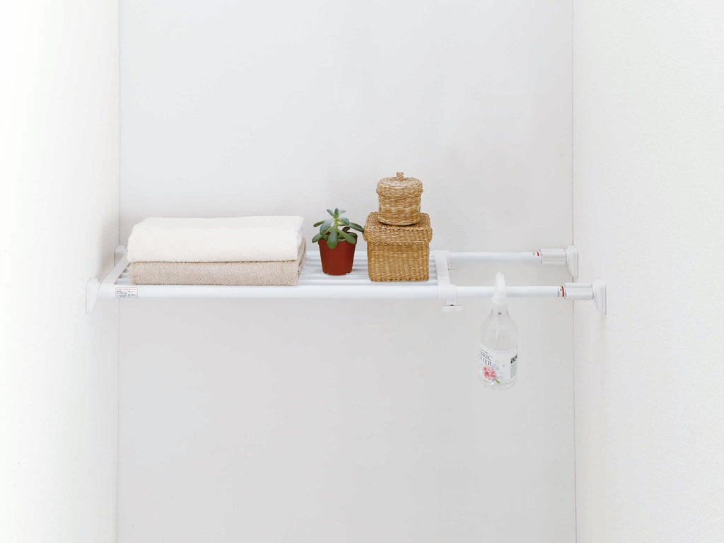 Tension shelves can hold towels, spray bottles, and more