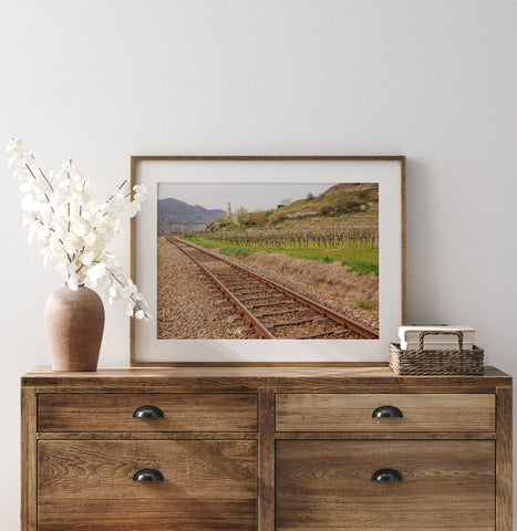 Landscape art print of train tracks in between vineyards