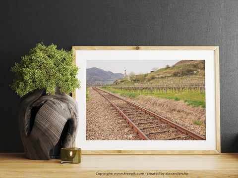 Inspiring office wall art of train tracks cutting through vineyards