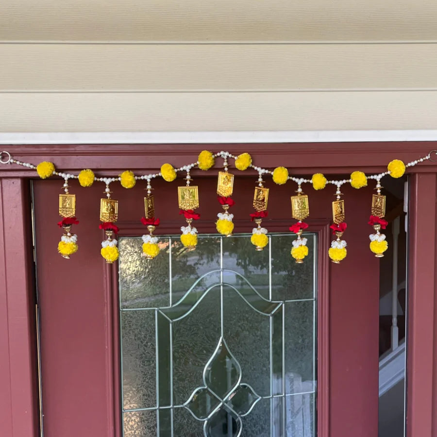 Torans are decorative door hangings made of mango leaves, flowers, or beads.