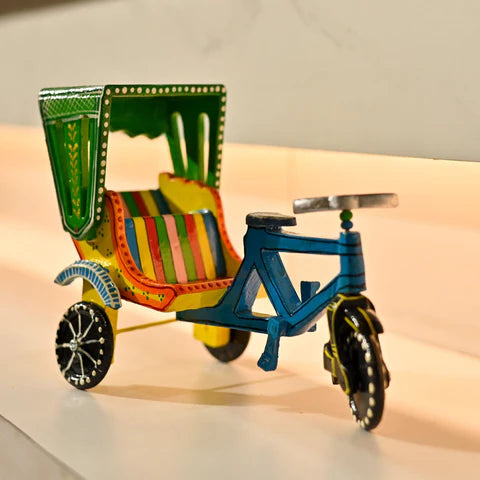 Wooden Rikshaw Cycle toy that is coloured and vibrant and you can get this special toy from LoveNspire.
