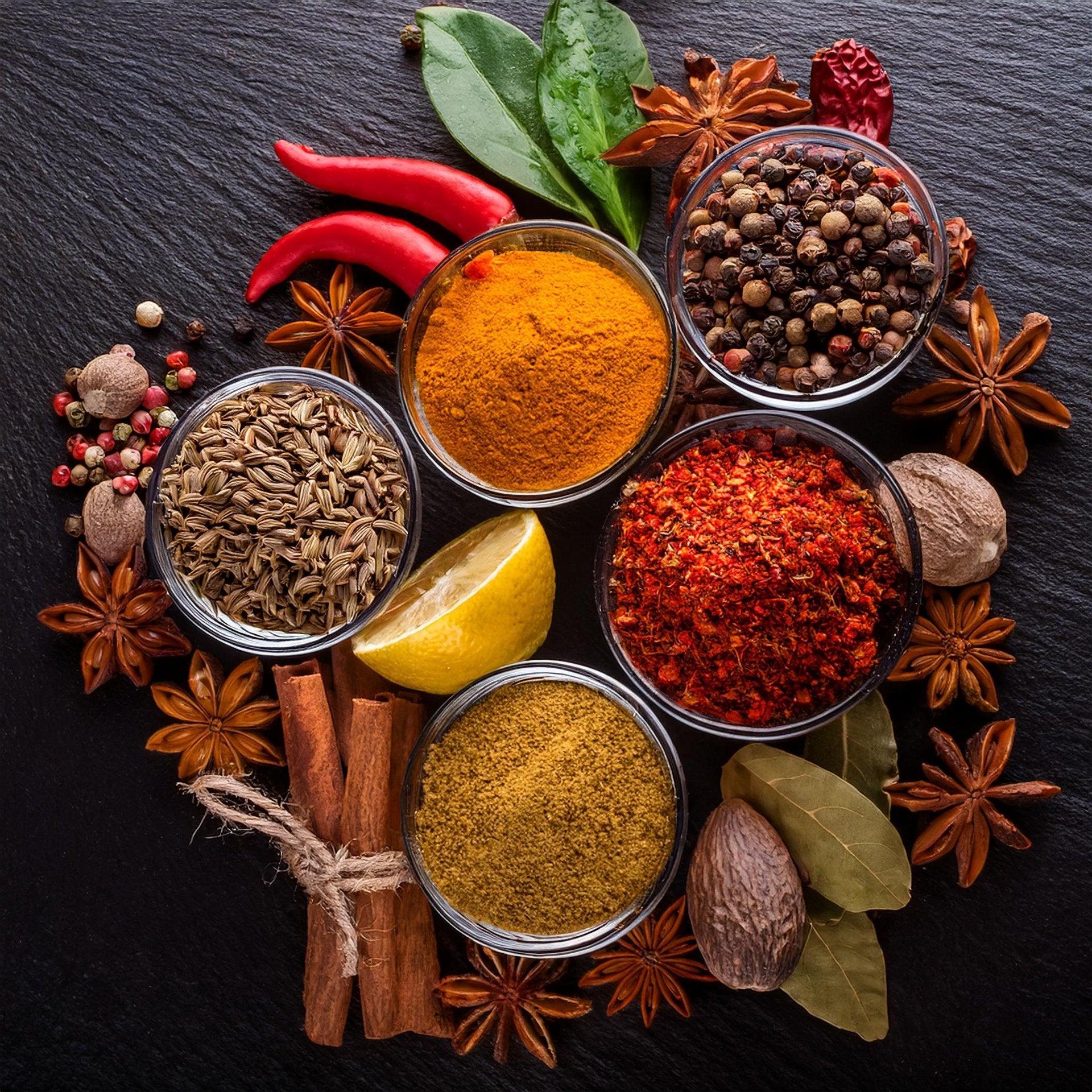 Every cook must have salt, black pepper, garlic powder, paprika, cumin, chili powder, cinnamon, turmeric, oregano, and bay leave as integral parts of an Indian kitchen.