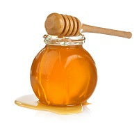 Glass jar of honey