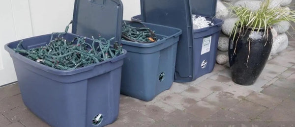 Christmas lights stored in stackable totes