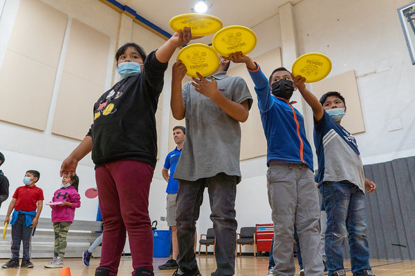 Kids Playing Disc Golf OTB Open