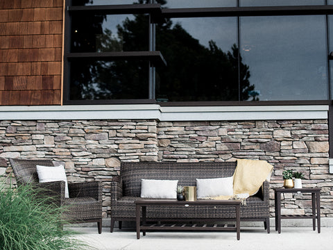 The Biltmore Outdoor Living Collection by Ratana featuring a resin wicker finish in wild truffle. Outdoor sofa, club chair, club swivel chair, end table, and coffee table.