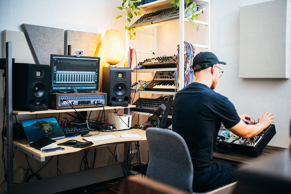 a man making music in a home studio