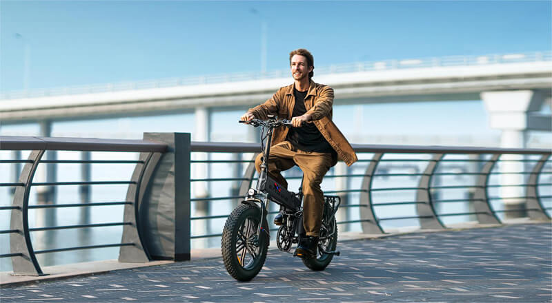 a man rides an engwe engine pro folding electric bike