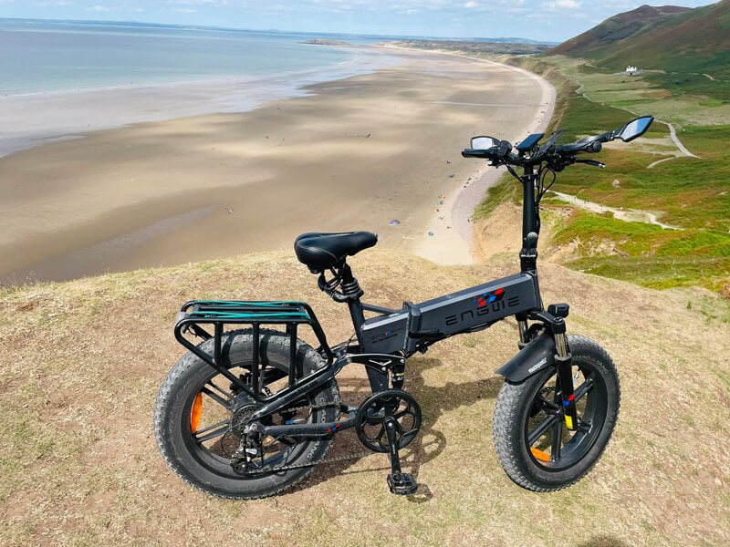 a black engwe engine pro fat e-bike on the grass