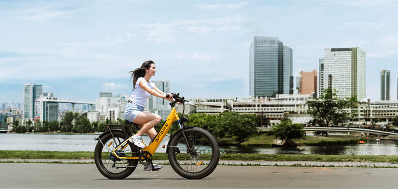a girl riding an urban e bike - engwe e26