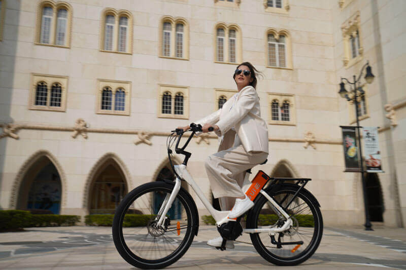 a lady riding an engwe p275 st e-bike