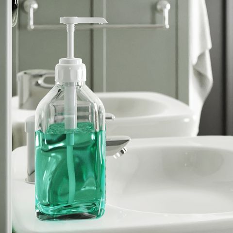 ebun glass mouthwash container on the bathroom countertop