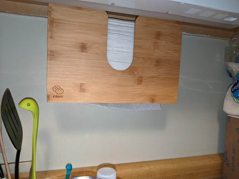 paper towel dispenser in the kitchen under the cabinet