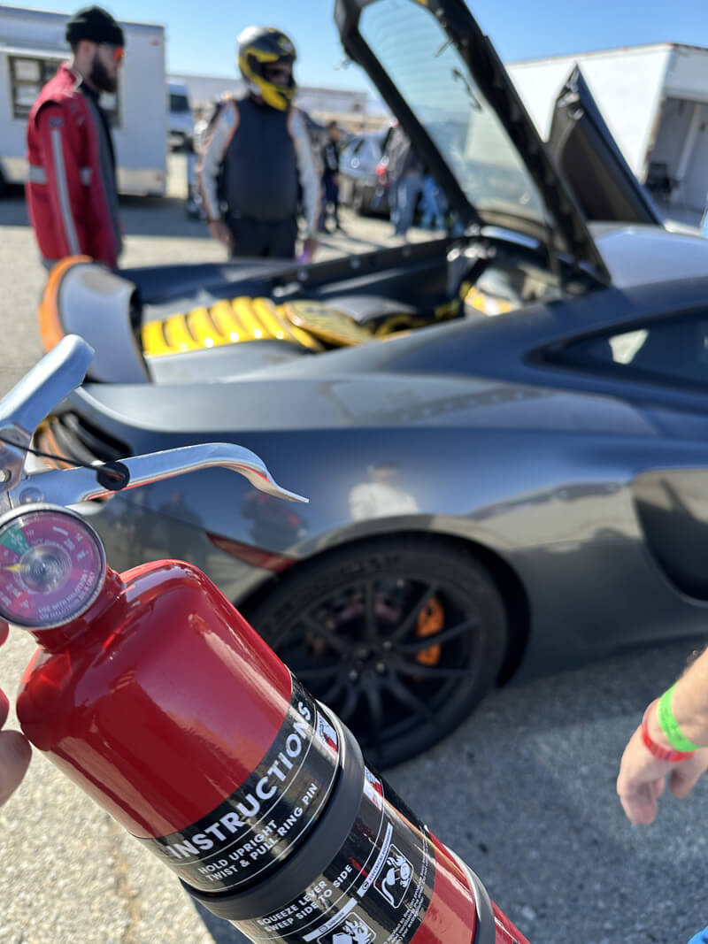 Fire extinguisher just used to put out a fire on a McLaren