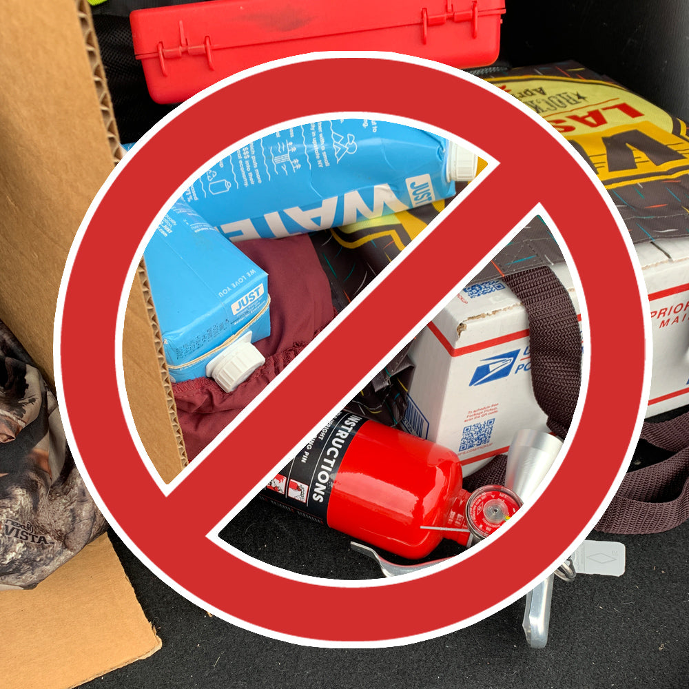 image of a fire extinguisher in the trunk with a bunch of stuff and a no-go emblem over i