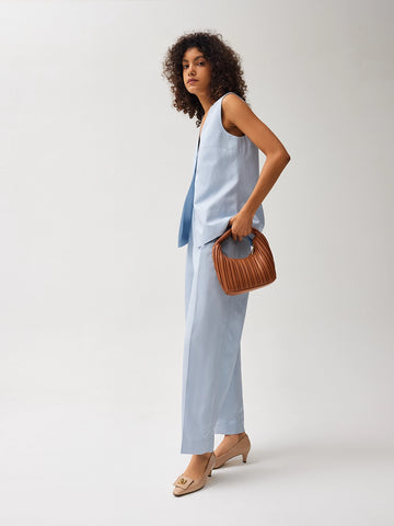 (1)	PAZZION OFFICIAL_ Celia Pleated Bag_6141_Caramel crescent-shaped leather bag with pleated texture and gold zipper_ Kora Square Buckle Patent Heels_123-12a_Pink patent leather low-heel pumps with a metallic bow accent.