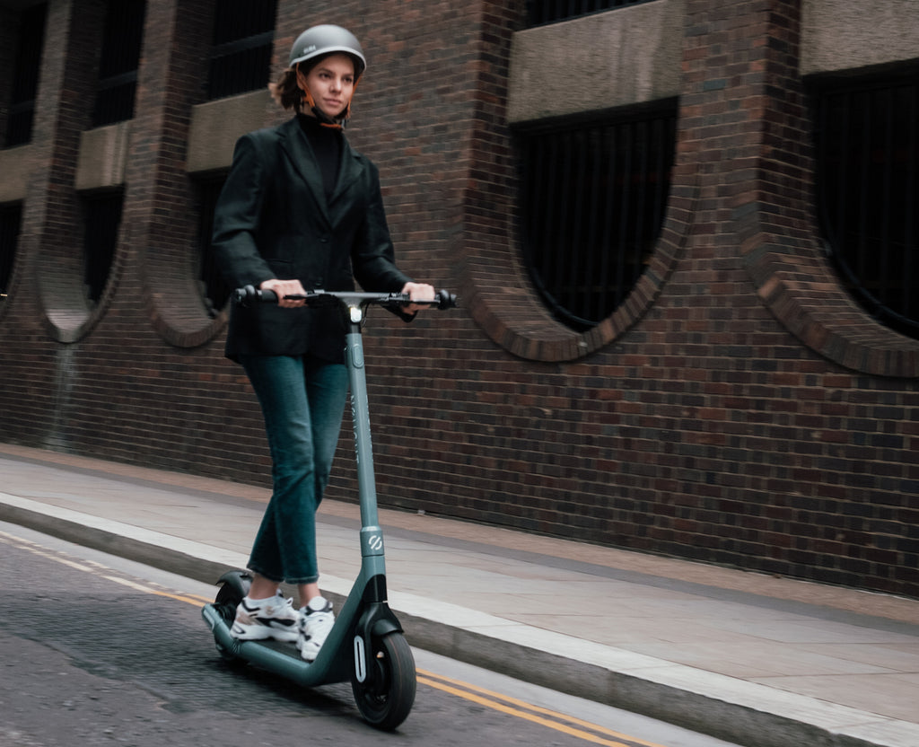 Girl riding electric scooter 