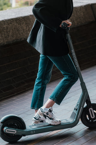 girl riding electric scooter 