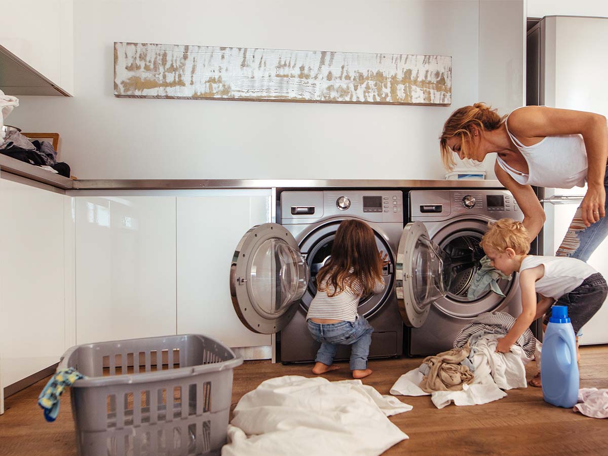 Image of mom and daughter putting away laundry