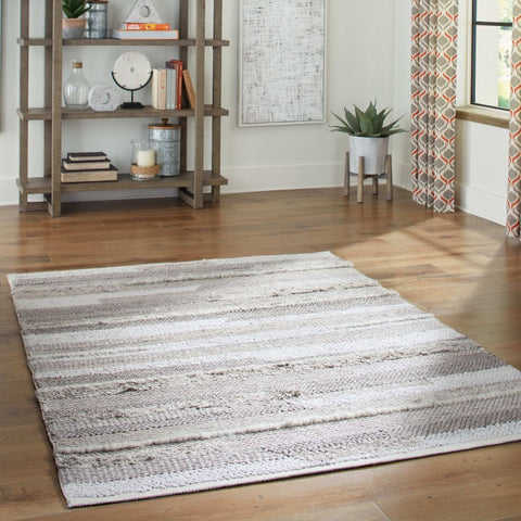 Image of a throw rug on a wooden floor