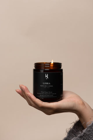 the skincare candle on hand