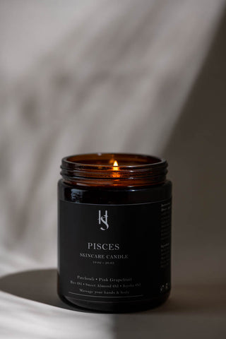 Pisces candle shot under shadow and decoration.
