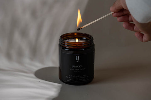 Lighting up a fragranced candle with matches of The Hubble Studio.