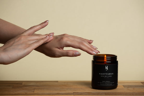 Skincare Candle massages on hands of The Hubble Studio.