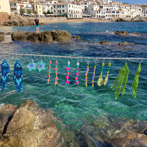 Earrings hanging over the sea