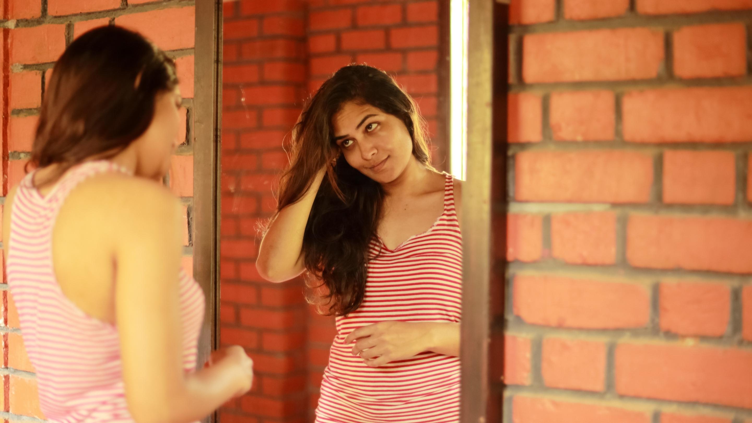 Girl looking at Mirror