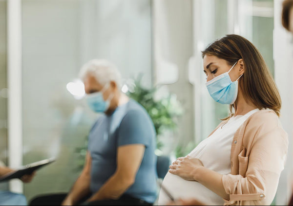 pregnant woman waiting for line at hospital