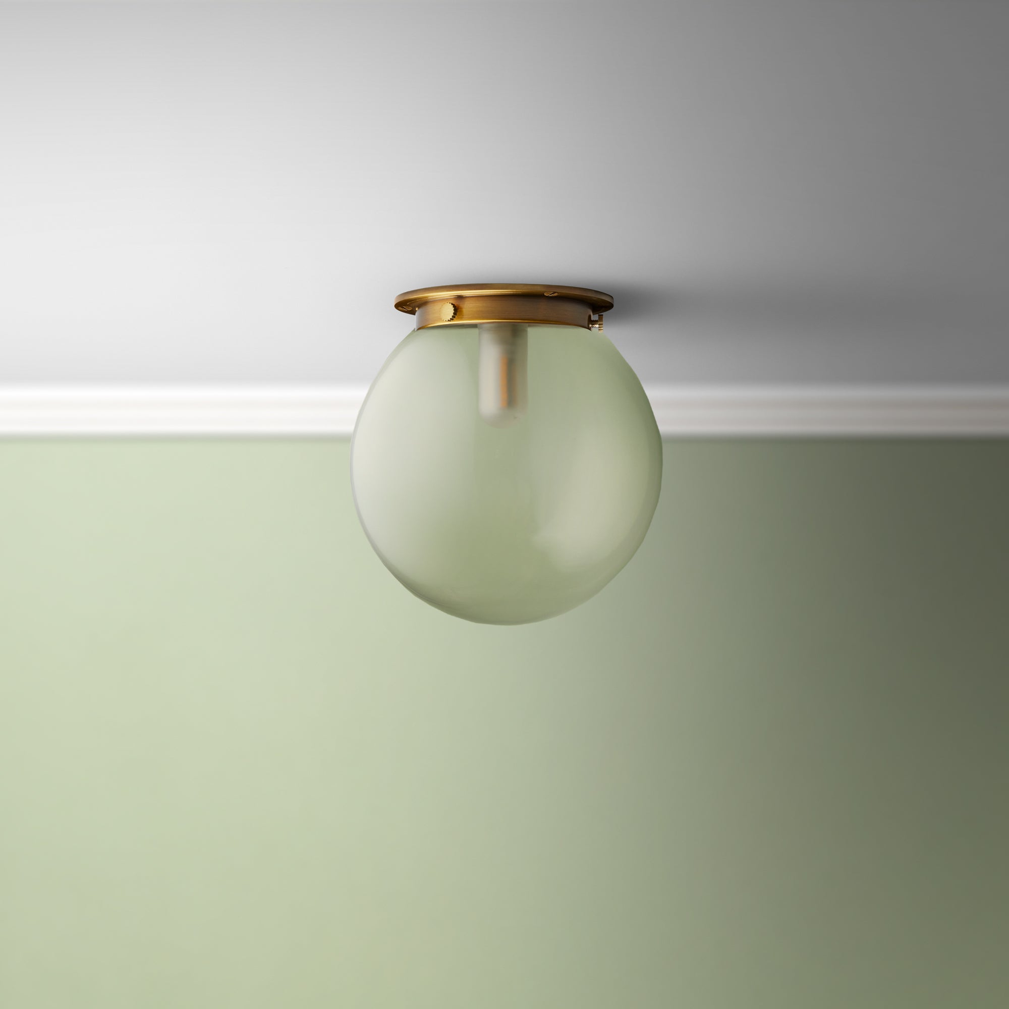 smaller plumb wall fitting in antiqued brass with smaller espere in clear glass