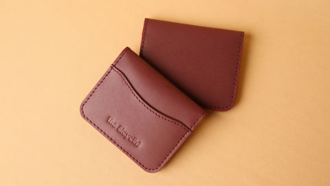 Pair of Bifold Card Wallet from The Bicyclist in Maroon Leather one on top of the other
