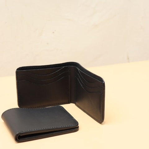 A pair of The Bicyclists Bifold Leather card wallets with six card slots one open and the other shut