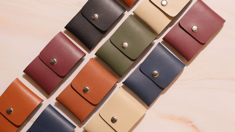 Diagonal image of Three rows of Leather Card Cases in Multiple colors from The Bicyclist
