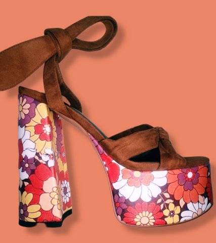 Suede wrap 70's inspired platforms with floral design on platform and heel. Criss cross open toe design.