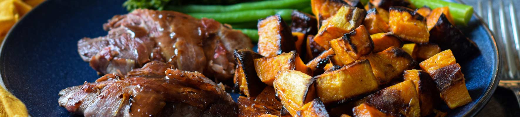 Pan-fried grouse with roasted sweet potatoes, pancetta and sticky sherry-soy sauce